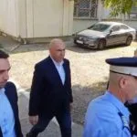 Bolojan audiat la DNA, iar sindicatul din Guvern cere demisia